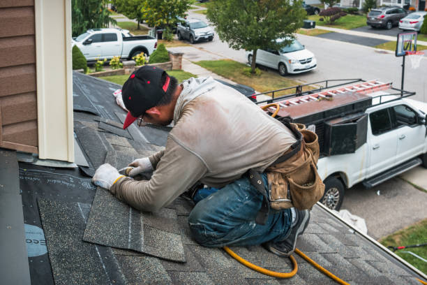 Professional Roofing technician working in Marshall, AR